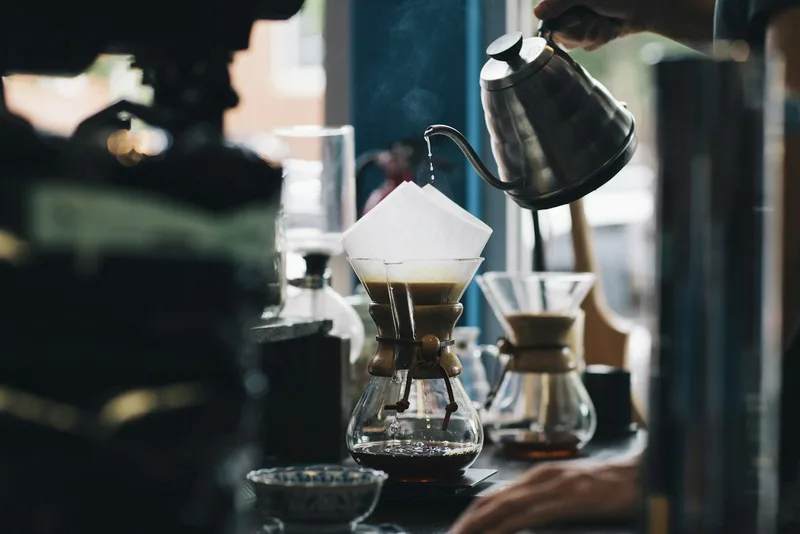 A barista pouring coffee