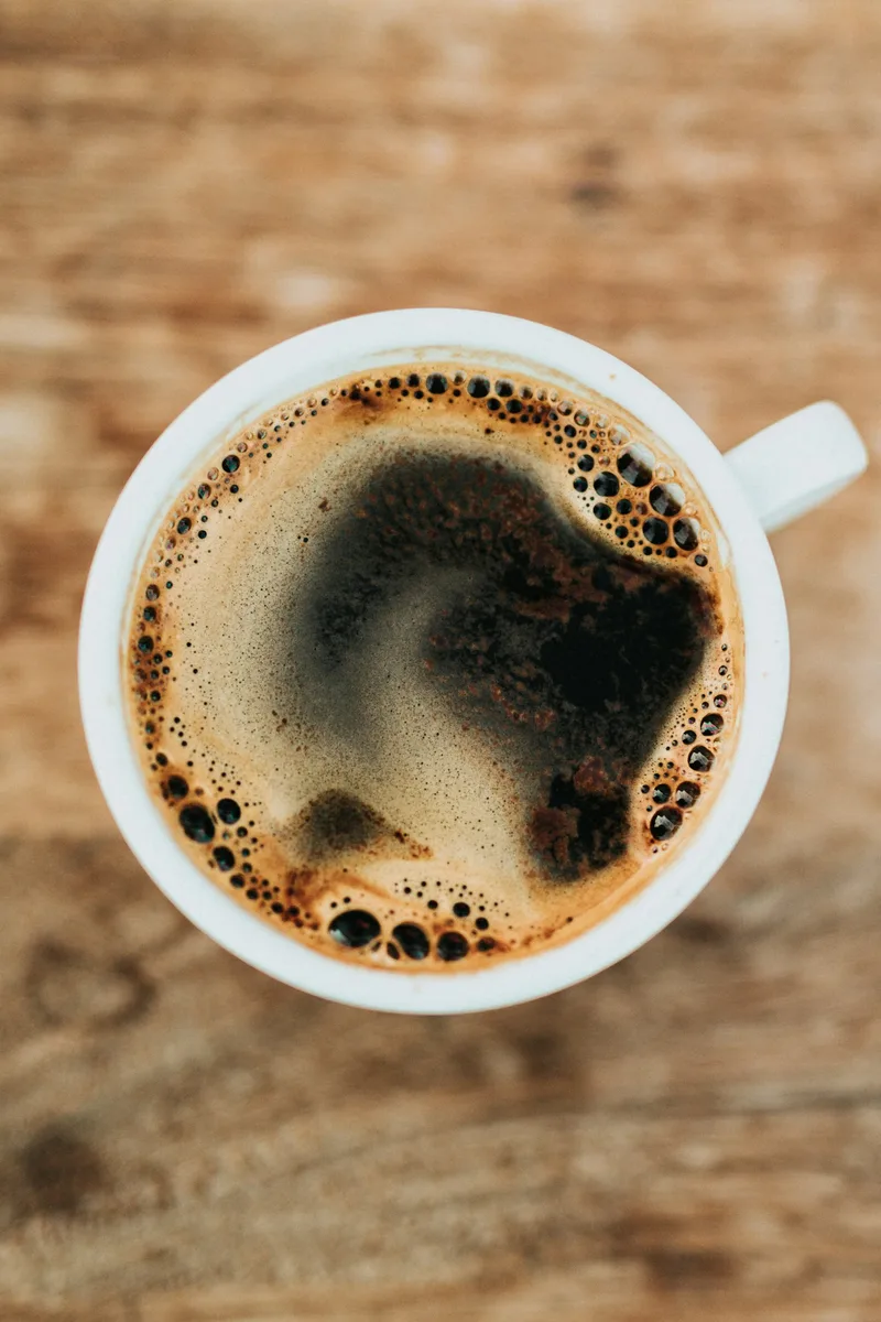 Coffee and a notebook on a café table